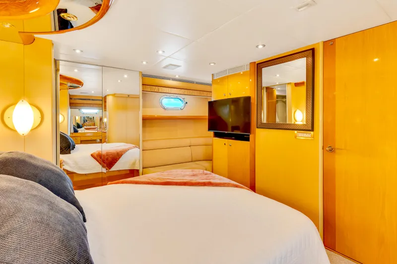 Marvelous Yacht Photos Pics Luxurious bedroom interior of 1999 Cheoy Lee 74 yacht with modern amenities.