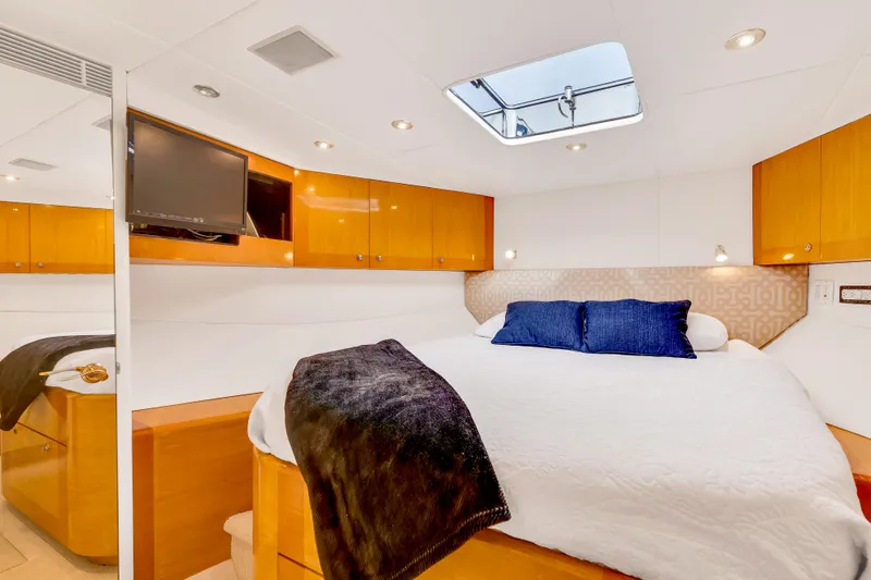 Marvelous Yacht Photos Pics Luxurious bedroom interior of 1999 Cheoy Lee 74 yacht with skylight and modern amenities.