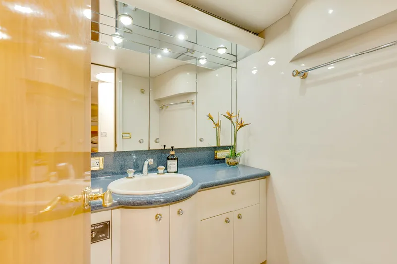 Marvelous Yacht Photos Pics Luxurious bathroom in 1999 Cheoy Lee 74 yacht with modern fixtures and elegant design.