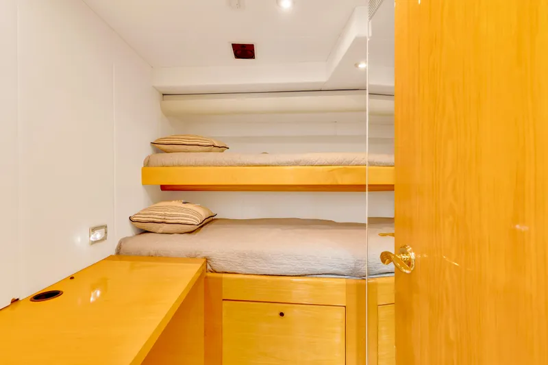 Marvelous Yacht Photos Pics Cozy cabin with bunk beds on 1999 Cheoy Lee 74 yacht.