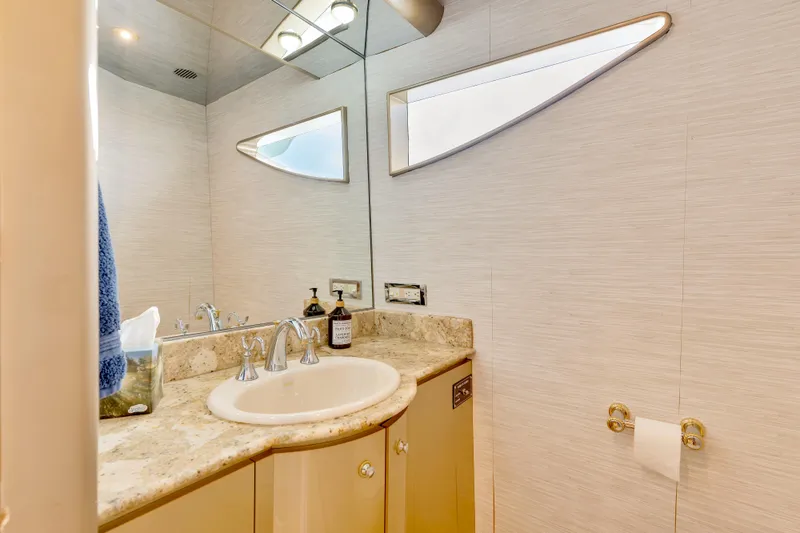 Marvelous Yacht Photos Pics Luxurious bathroom in 1999 Cheoy Lee 74 yacht with modern fixtures and elegant design.