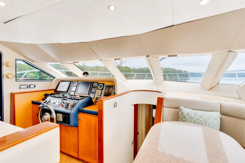 Marvelous Yacht Photos Pics Luxurious 1999 Cheoy Lee 74 yacht interior with modern helm and plush seating.