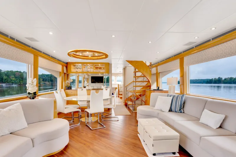 Marvelous Yacht Photos Pics Luxurious interior of a 1999 Cheoy Lee 74 yacht with elegant seating and dining area.