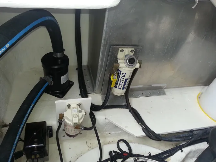 Johnny B Good Yacht Photos Pics Engine compartment of 2007 Regal Commodore 4060 with visible hoses and components.