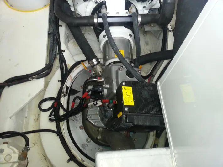 Johnny B Good Yacht Photos Pics Engine compartment of a 2007 Regal Commodore 4060 boat, showing mechanical components and wiring.