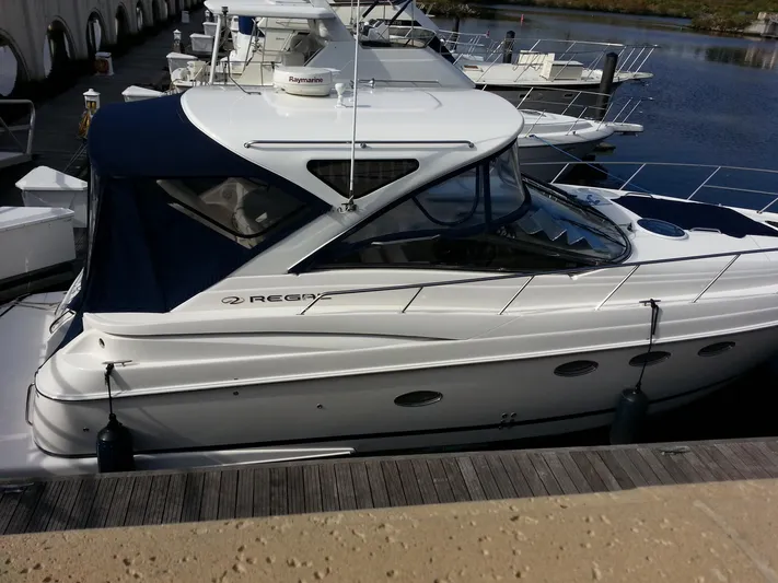 Johnny B Good Yacht Photos Pics 2007 Regal Commodore 4060 yacht docked at marina, featuring sleek design and white exterior.