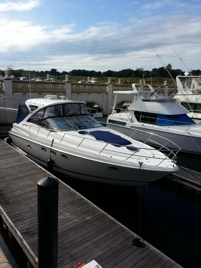 Johnny B Good Yacht Photos Pics 2007 Regal Commodore 4060 yacht docked at a marina under a partly cloudy sky.
