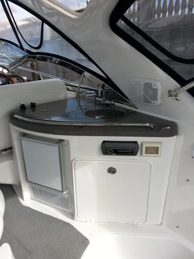 Johnny B Good Yacht Photos Pics 2007 Regal Commodore 4060 yacht interior with kitchenette and modern amenities.