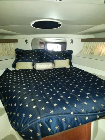 Johnny B Good Yacht Photos Pics Luxurious cabin interior of 2007 Regal Commodore 4060 yacht with star-patterned bedding.