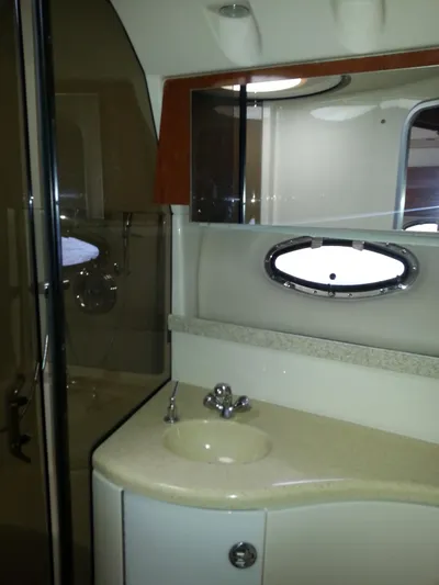 Johnny B Good Yacht Photos Pics 2007 Regal Commodore 4060 yacht bathroom with sink, mirror, and shower.