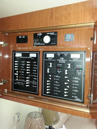 Johnny B Good Yacht Photos Pics Control panel of a 2007 Regal Commodore 4060 yacht, featuring various switches and gauges.