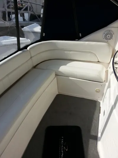 Johnny B Good Yacht Photos Pics 2007 Regal Commodore 4060 interior with white seating and carpeted floor.