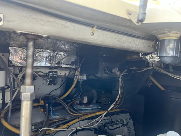  Yacht Photos Pics Engine room of 1999 Carver 530 Voyager Pilothouse with visible wiring and components.