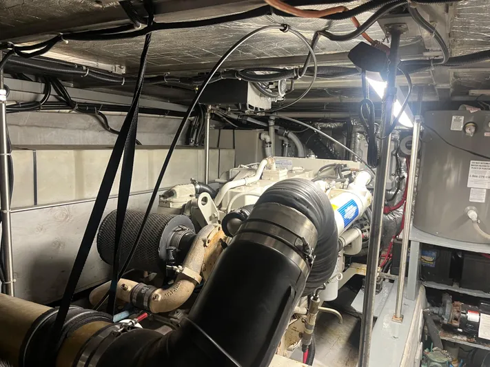  Yacht Photos Pics Engine room of 1999 Carver 530 Voyager Pilothouse with visible machinery and components.