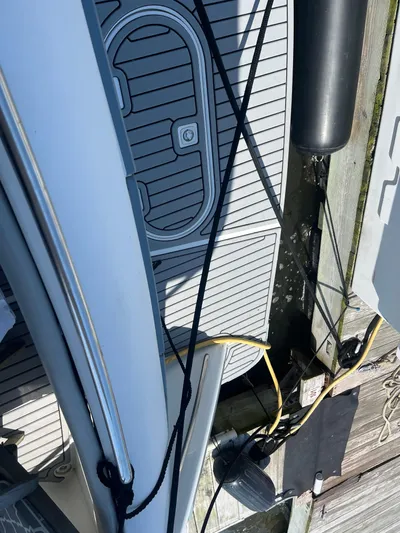  Yacht Photos Pics Overhead view of 1999 Carver 530 Voyager Pilothouse docked, showing deck and mooring lines.