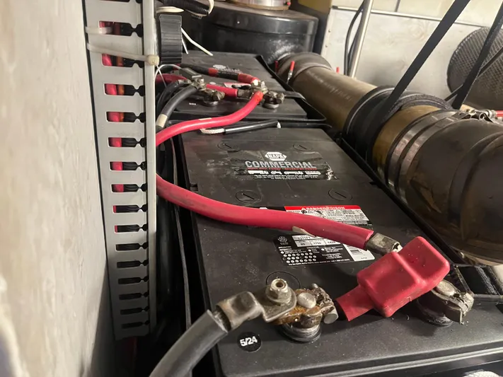  Yacht Photos Pics Battery compartment of 1999 Carver 530 Voyager Pilothouse with red cables and connectors.