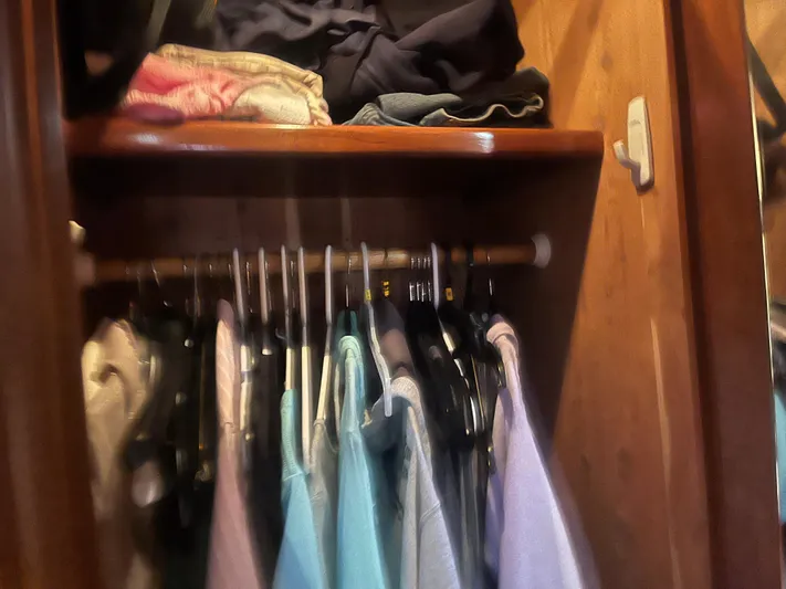  Yacht Photos Pics Clothes hanging in a wooden closet on a 1999 Carver 530 Voyager Pilothouse.