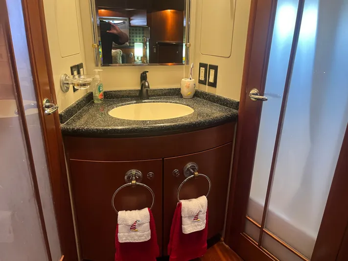  Yacht Photos Pics Luxurious bathroom in 1999 Carver 530 Voyager Pilothouse yacht with elegant sink and towels.