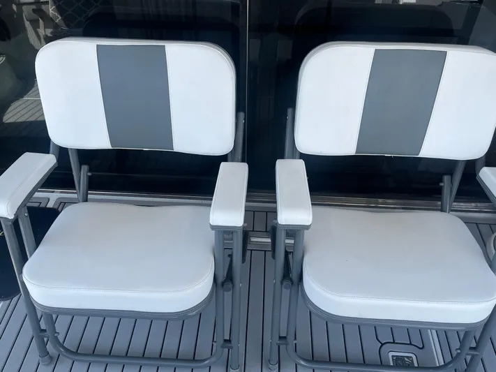  Yacht Photos Pics Two white and gray cushioned chairs on a 1999 Carver 530 Voyager Pilothouse yacht.