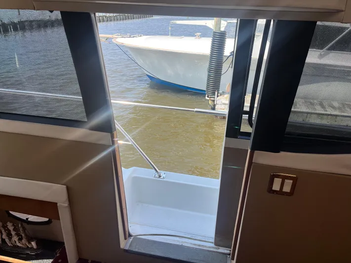  Yacht Photos Pics View from 1999 Carver 530 Voyager Pilothouse, looking out to docked boat.