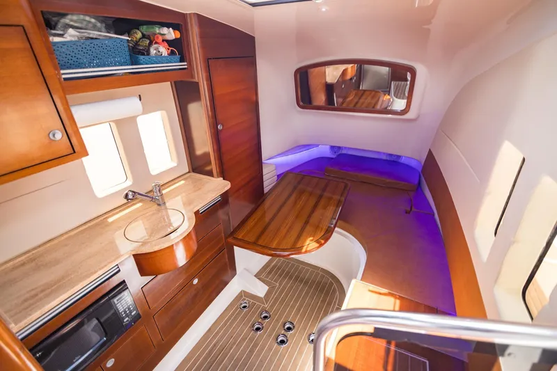  Yacht Photos Pics Luxurious interior of 2016 Edgewater 368CC boat with wood finishes and modern amenities.