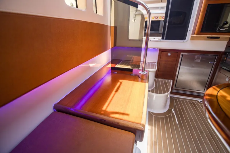  Yacht Photos Pics Interior of 2016 Edgewater 368CC boat with wood accents and ambient lighting.