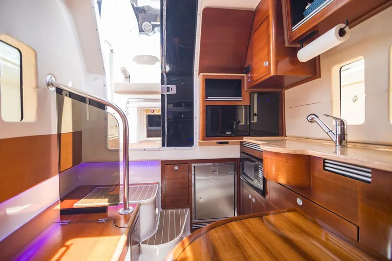  Yacht Photos Pics Luxurious interior of 2016 Edgewater 368CC boat with modern kitchen amenities.