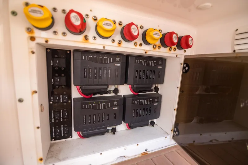  Yacht Photos Pics Electrical panel of a 2016 Edgewater 368CC boat, featuring circuit breakers and switches.