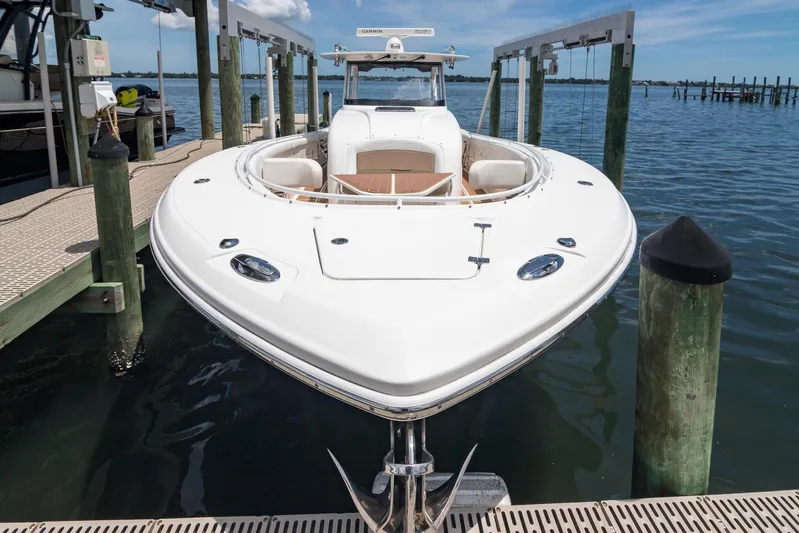  Yacht Photos Pics 2016 Edgewater 368CC boat docked at marina, showcasing sleek design and spacious deck.