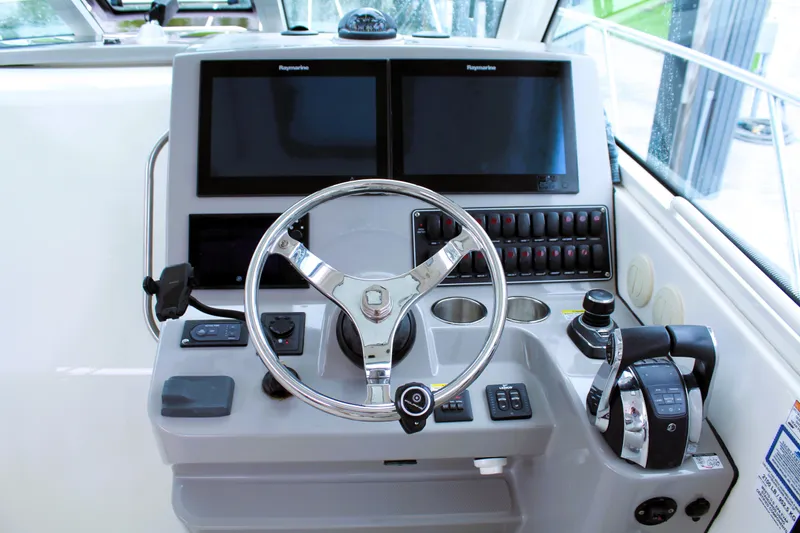 F-troop Yacht Photos Pics Helm of 2017 Boston Whaler 345 Conquest with dual Raymarine displays and controls.