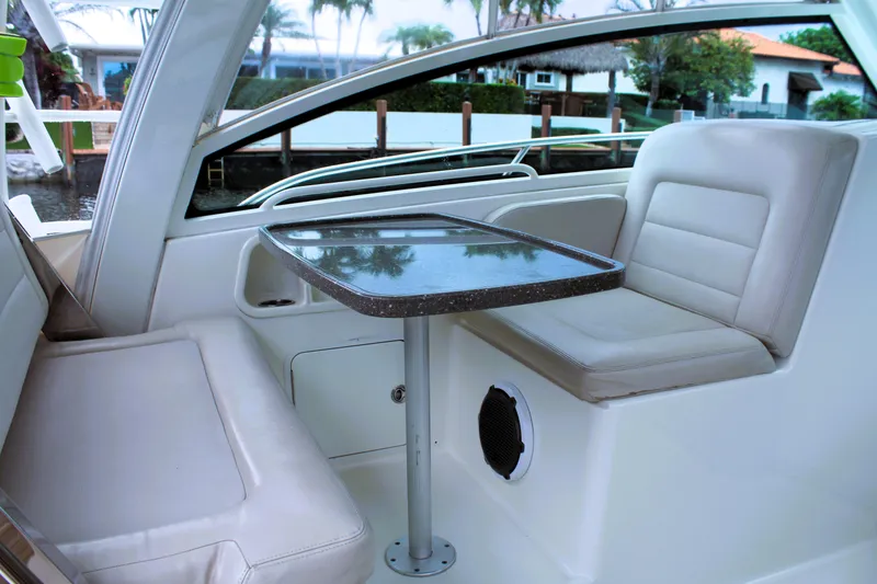 F-troop Yacht Photos Pics 2017 Boston Whaler 345 Conquest interior seating with table, featuring sleek design and comfort.