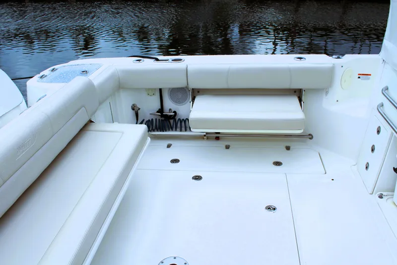 F-troop Yacht Photos Pics 2017 Boston Whaler 345 Conquest boat interior with white seating and water view.