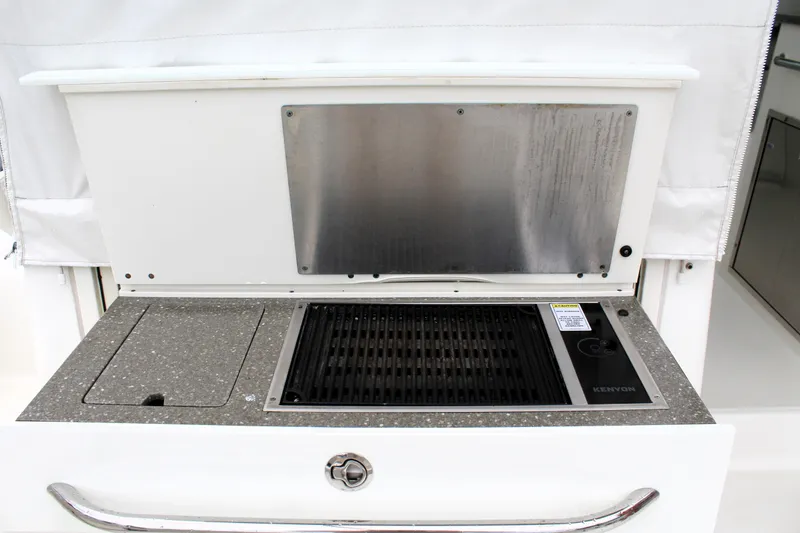 F-troop Yacht Photos Pics Outdoor grill on 2017 Boston Whaler 345 Conquest boat, featuring Kenyon cooking surface.
