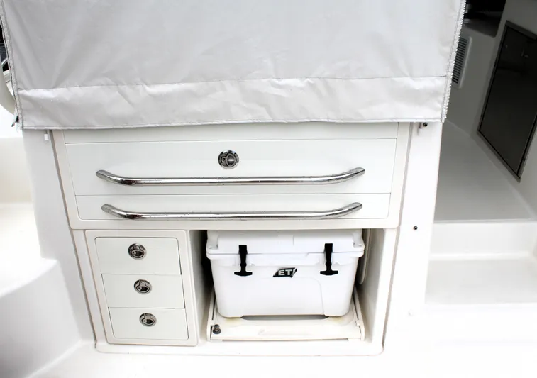 F-troop Yacht Photos Pics 2017 Boston Whaler 345 Conquest storage area with drawers and cooler.
