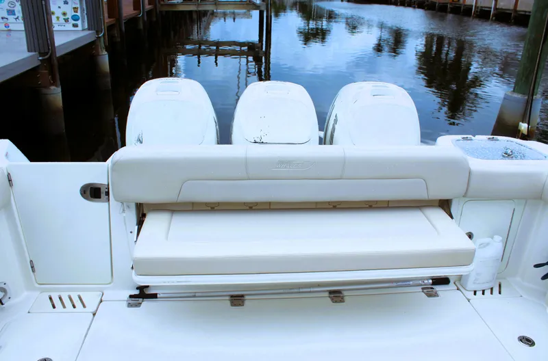 F-troop Yacht Photos Pics 2017 Boston Whaler 345 Conquest boat with triple outboard engines at dock.