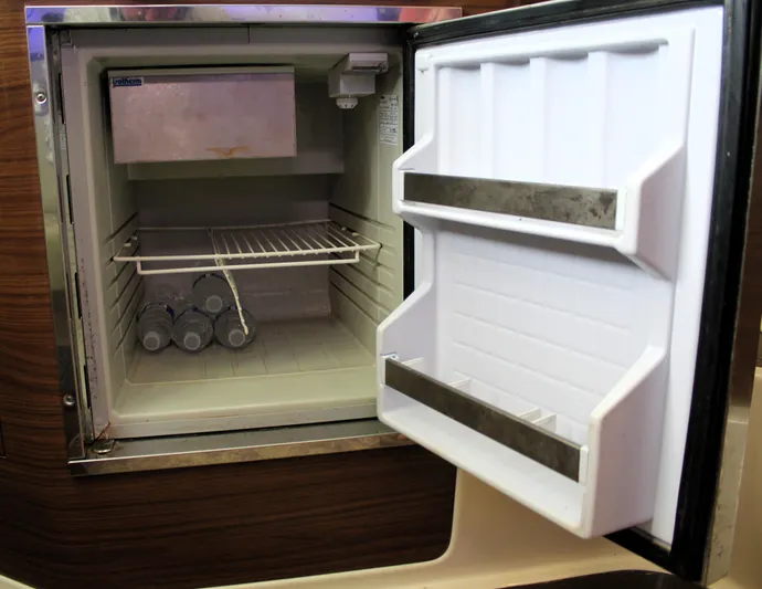F-troop Yacht Photos Pics Open mini fridge on 2017 Boston Whaler 345 Conquest, containing water bottles.