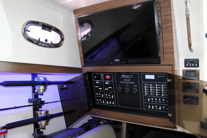 F-troop Yacht Photos Pics Control panel and TV inside a 2017 Boston Whaler 345 Conquest boat cabin.