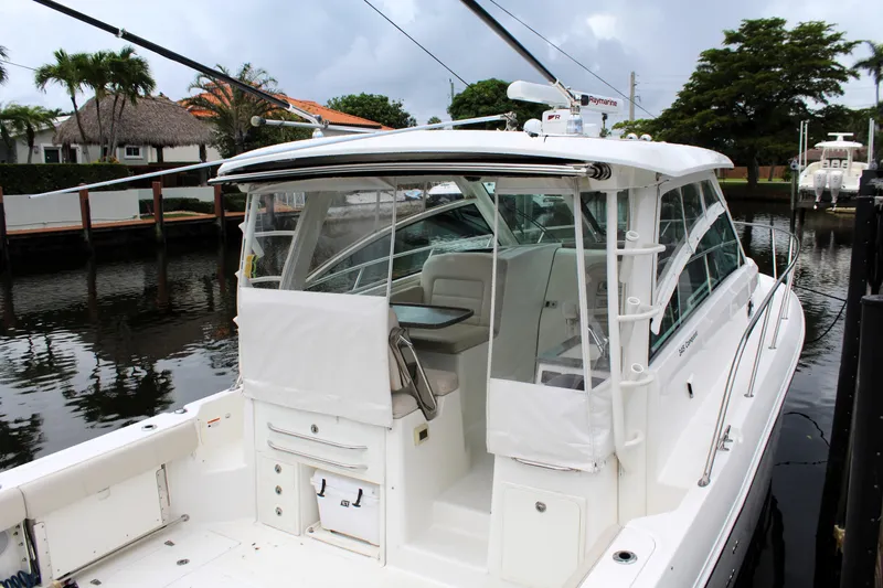 F-troop Yacht Photos Pics 2017 Boston Whaler 345 Conquest docked, showcasing sleek design and spacious cockpit.