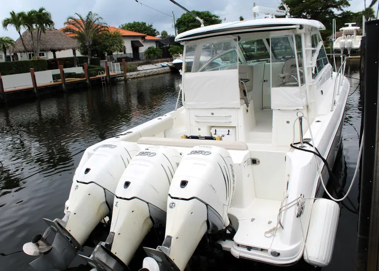 F-troop Yacht Photos Pics 2017 Boston Whaler 345 Conquest boat docked with triple outboard engines.