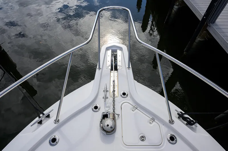 F-troop Yacht Photos Pics Bow view of 2017 Boston Whaler 345 Conquest, reflecting on calm water.