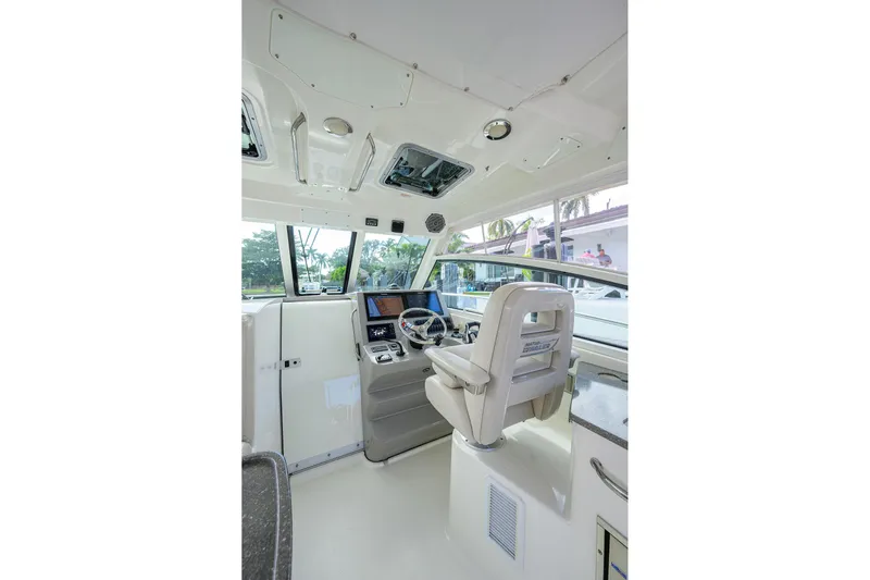 F-troop Yacht Photos Pics 2017 Boston Whaler 345 Conquest helm with modern controls and comfortable seating.