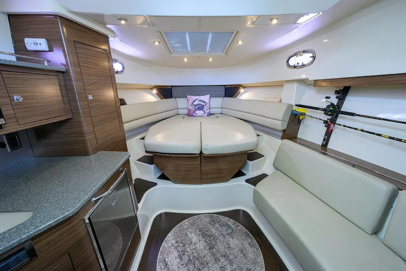 F-troop Yacht Photos Pics Luxurious interior of 2017 Boston Whaler 345 Conquest boat with modern seating and fishing rods.