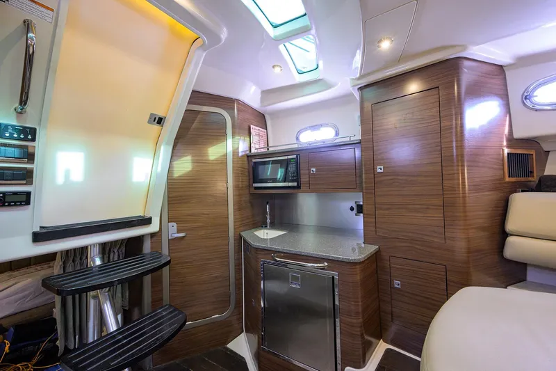 F-troop Yacht Photos Pics Luxurious interior of 2017 Boston Whaler 345 Conquest with modern kitchen amenities.