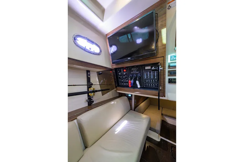 F-troop Yacht Photos Pics Interior of 2017 Boston Whaler 345 Conquest with control panel and seating area.