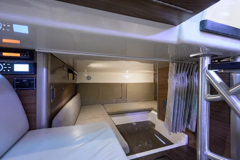 F-troop Yacht Photos Pics 2017 Boston Whaler 345 Conquest cabin interior with seating and modern amenities.