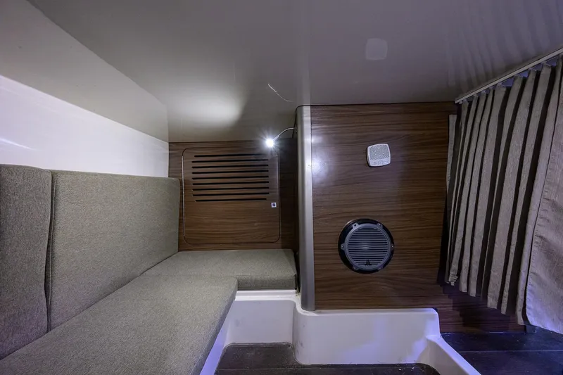 F-troop Yacht Photos Pics Interior cabin of 2017 Boston Whaler 345 Conquest with seating and wood paneling.