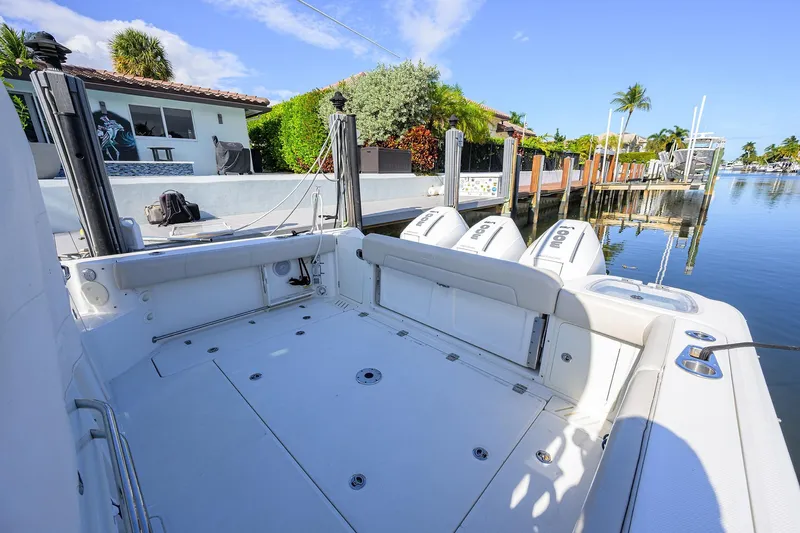 F-troop Yacht Photos Pics 2017 Boston Whaler 345 Conquest boat docked by waterfront home.