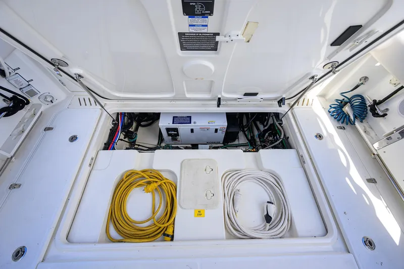 F-troop Yacht Photos Pics 2017 Boston Whaler 345 Conquest engine compartment with cables and equipment.