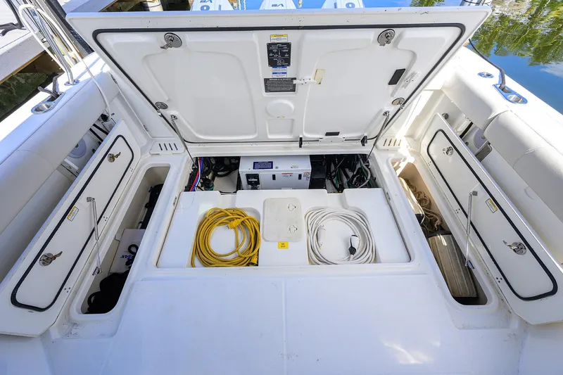 F-troop Yacht Photos Pics 2017 Boston Whaler 345 Conquest storage compartment with cables and equipment.