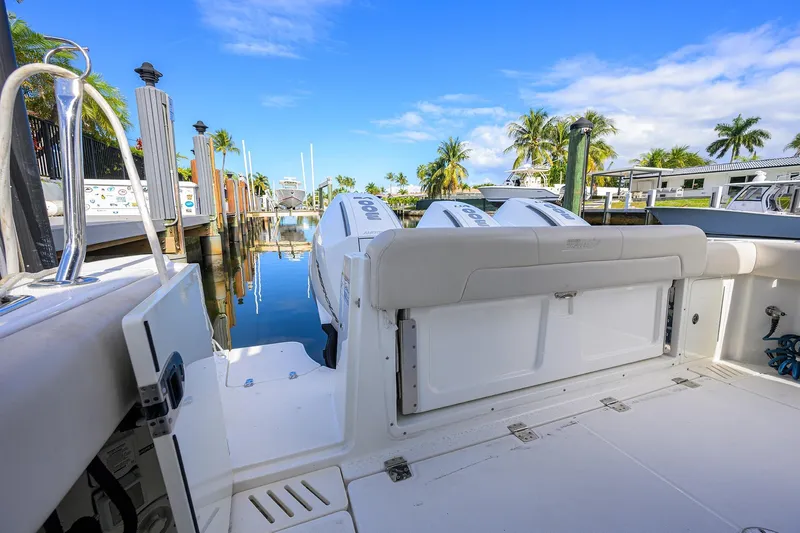F-troop Yacht Photos Pics 2017 Boston Whaler 345 Conquest docked, showcasing spacious deck and twin engines.